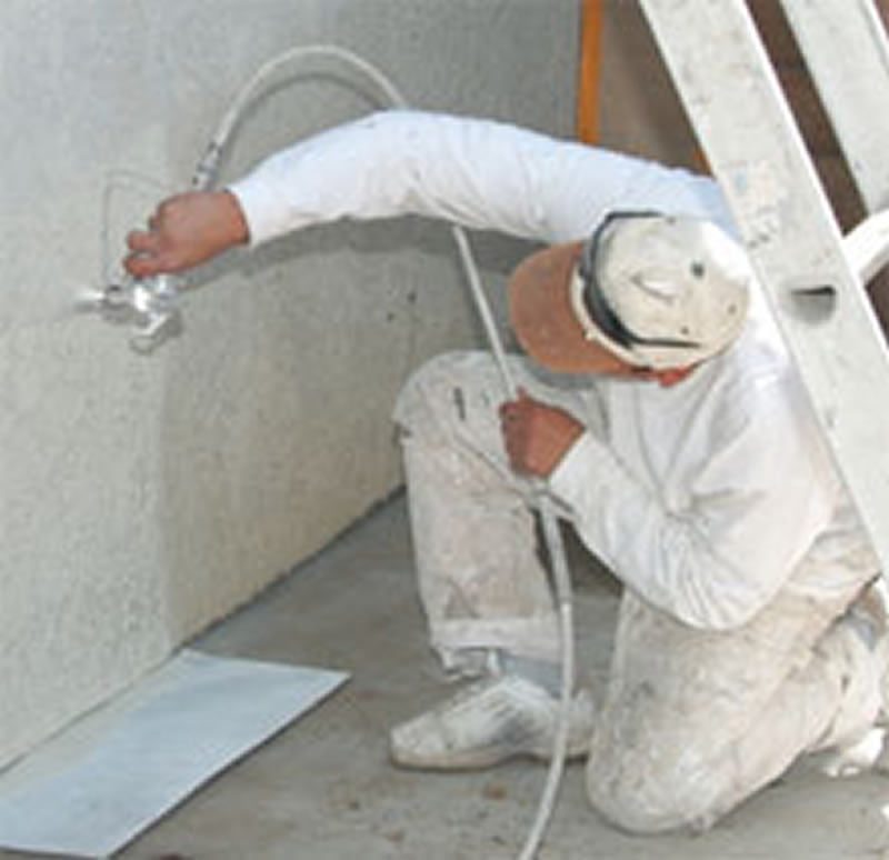 A Nurse Stucco technician at work on a repair